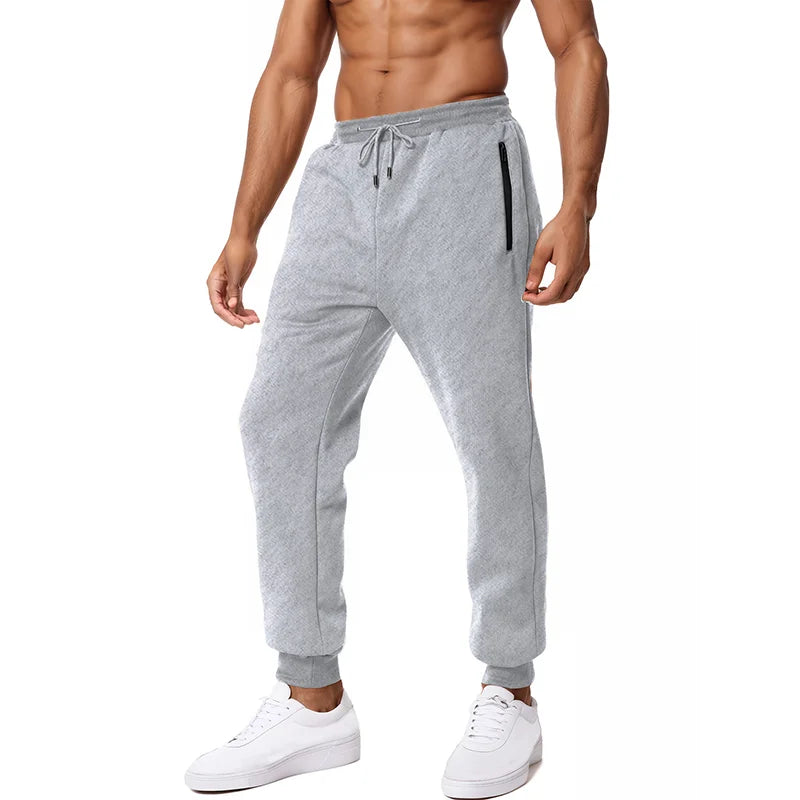 Nouveau Pantalon de Survêtement Homme, Poches Latérales Zippées, Jogging Sport Décontracté, Taille Élastique, Ample, pour le Fitness et la Gymnastique