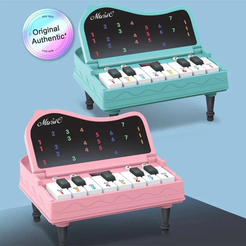 A handheld mini desktop piano with lights, music, electronic keyboard rhythm, and a game console for completing levels; a Montes